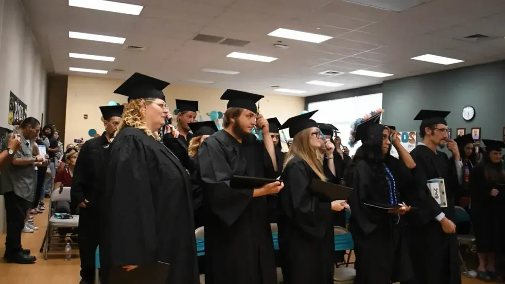 2023 CMC graduates turning their tassels on their caps